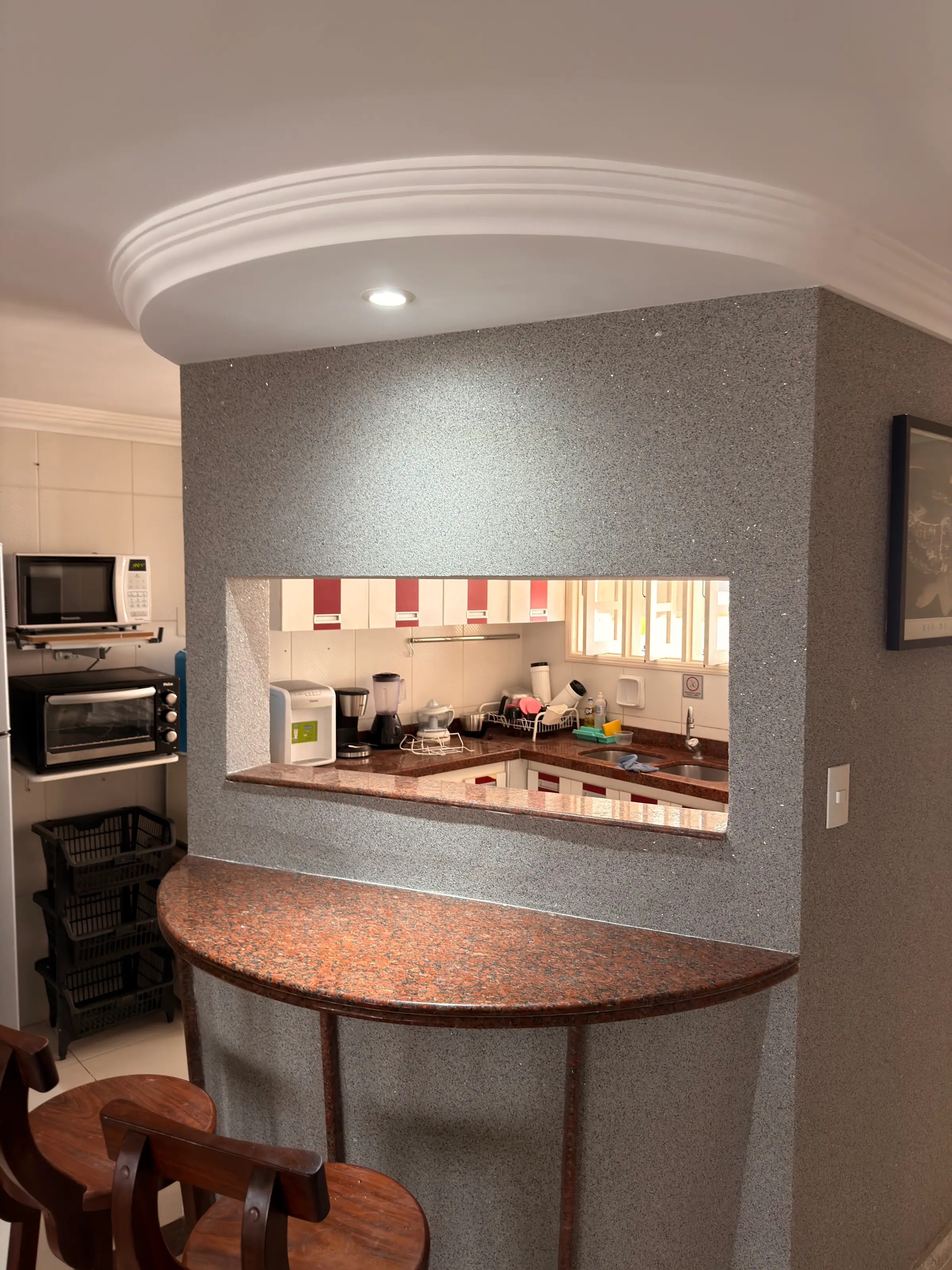 Kitchen with counter and stools